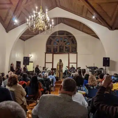 Audience enjoying a guest performance at the Richmond Area Arts Center