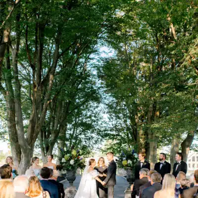 Bride and groom holding hands at the altar during their ceremony