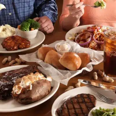 Entrees and sides on table at Texas Roadhouse