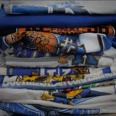 Pile of University of Kentucky shirts from True Heart Vintage