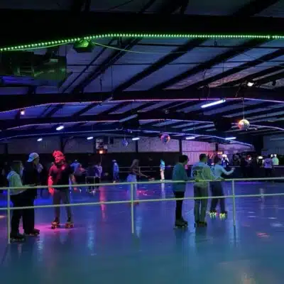 Young adults skating at Richmond Skate Center