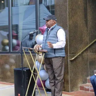 Mayor Robert Blythe speaking at the unveiling of the Squire Boone Rock in the window of City Hall