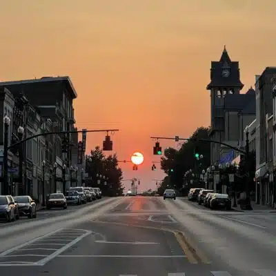 Sunset on Main Street featuring buildings in the walking tour book