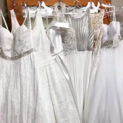 Range of dresses on hangers at Vivi's
