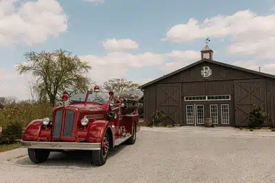 Vintage firetruck parked outside I Do at the Barn