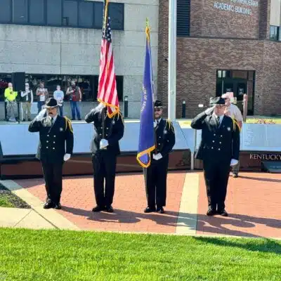 Honor guard standing in front of the memorial