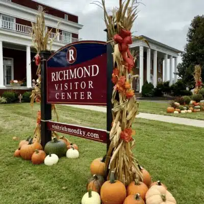 Fall display around sign in front yard of the Richmond Visitor Center