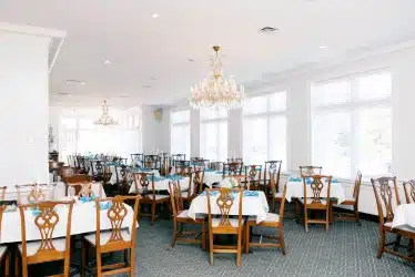 Interior of dining room with natural light coming through windows