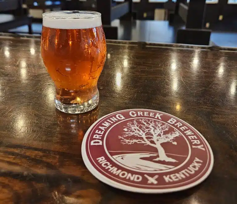 Dreaming Creek Brewery pint glass near coaster