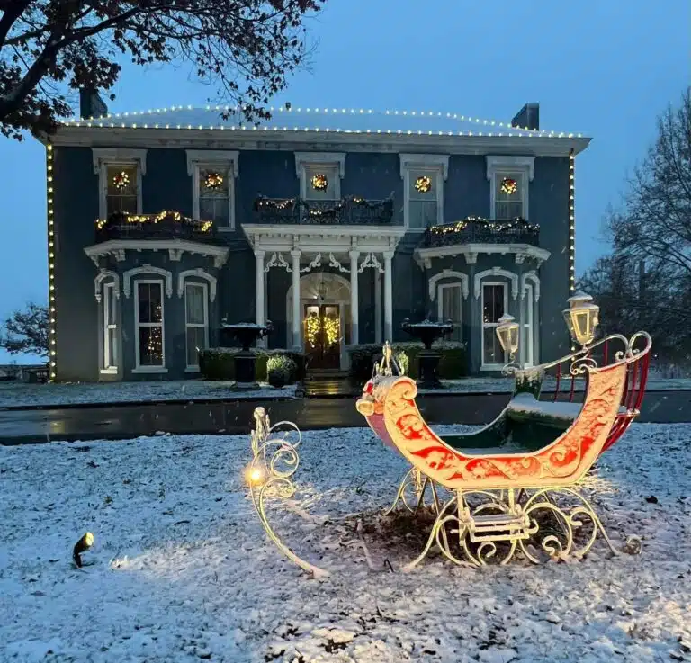 Snow covered Irvinton with sled and Christmas decorations