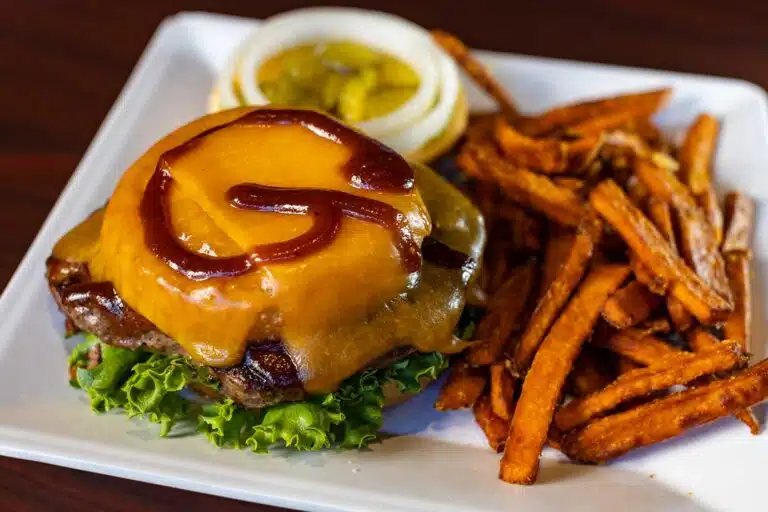 Gillum's cheeseburger with a 'g' of ketchup on it