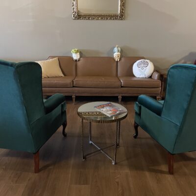 Brewtanicals Green Chairs and Leather Couch Gathering space