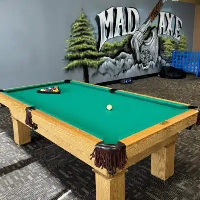 Pool table and mural at The Mad Axe