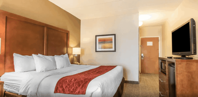 Bed and TV inside Comfort Suites