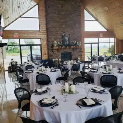 Reception space with mantle inside Lake Buck Lodge