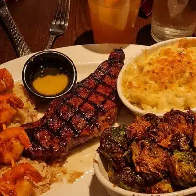 Aerial view of steak meal with shrimp and sides from Longhorn Steakhouse