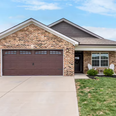 Exterior of short-term rental featuring a garage