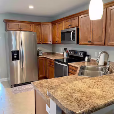 Kitchen featuring stainless steel appliances and granite countertops