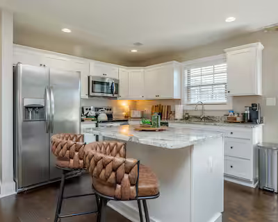 Kitchen and little dining island of short-term rental