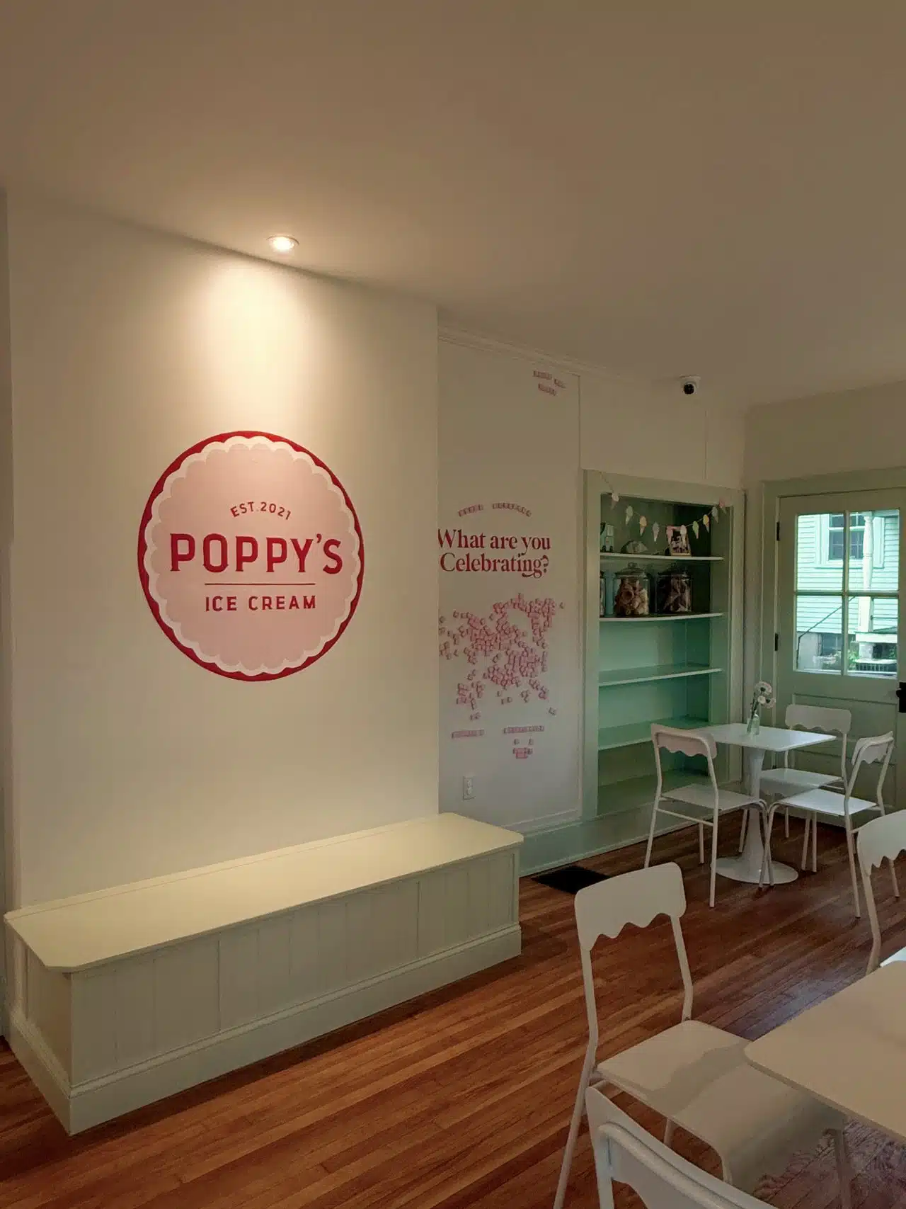 Interior of Poppy's Ice Cream showcasing the mint green and pink color scheme