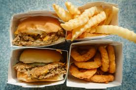 Aerial view of sliders, fries, and onion rings from White Castle